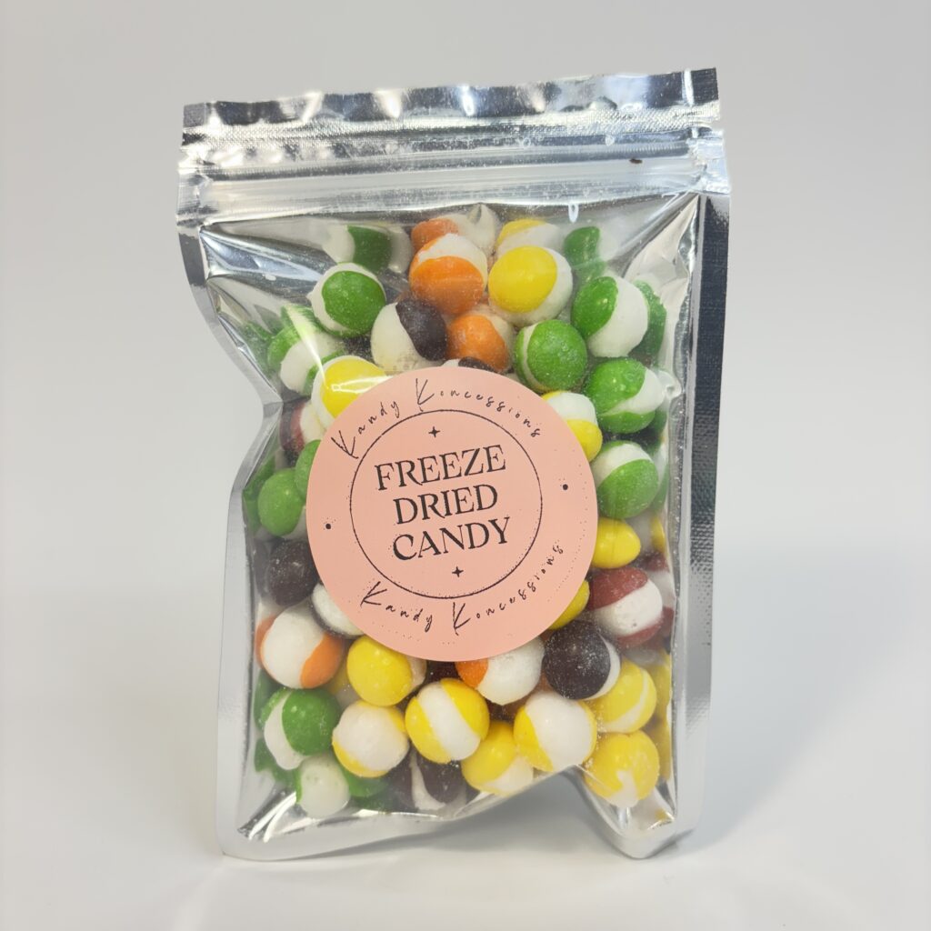 Assorted colors of round fruity candy in a silver mylar bag.