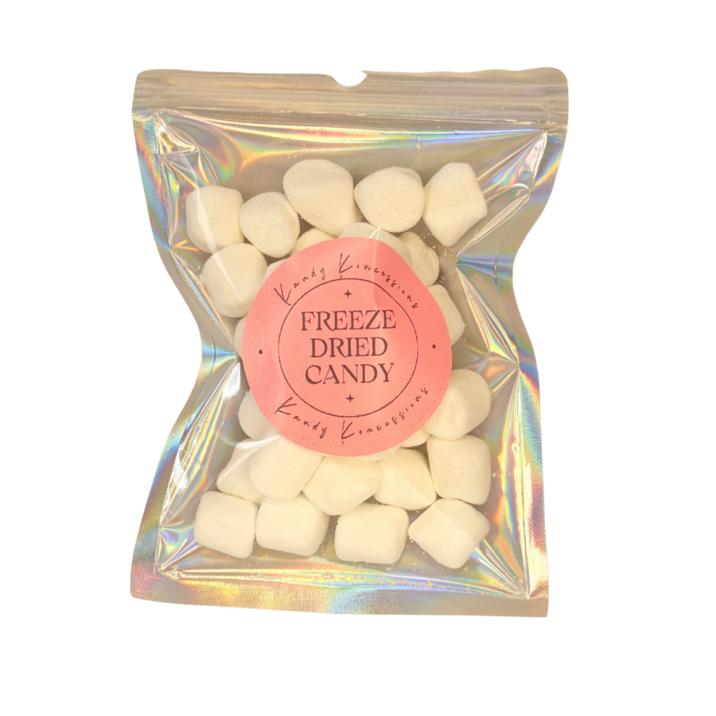 White free-dried mini marshmallows in a silver backed clear front mylar bag with a white background.